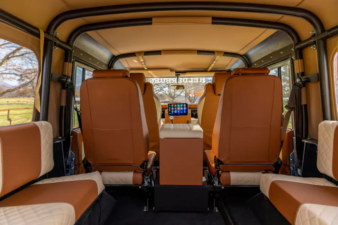 Bespoke Sand and Winter White leather upholstery inside a custom Defender 110.