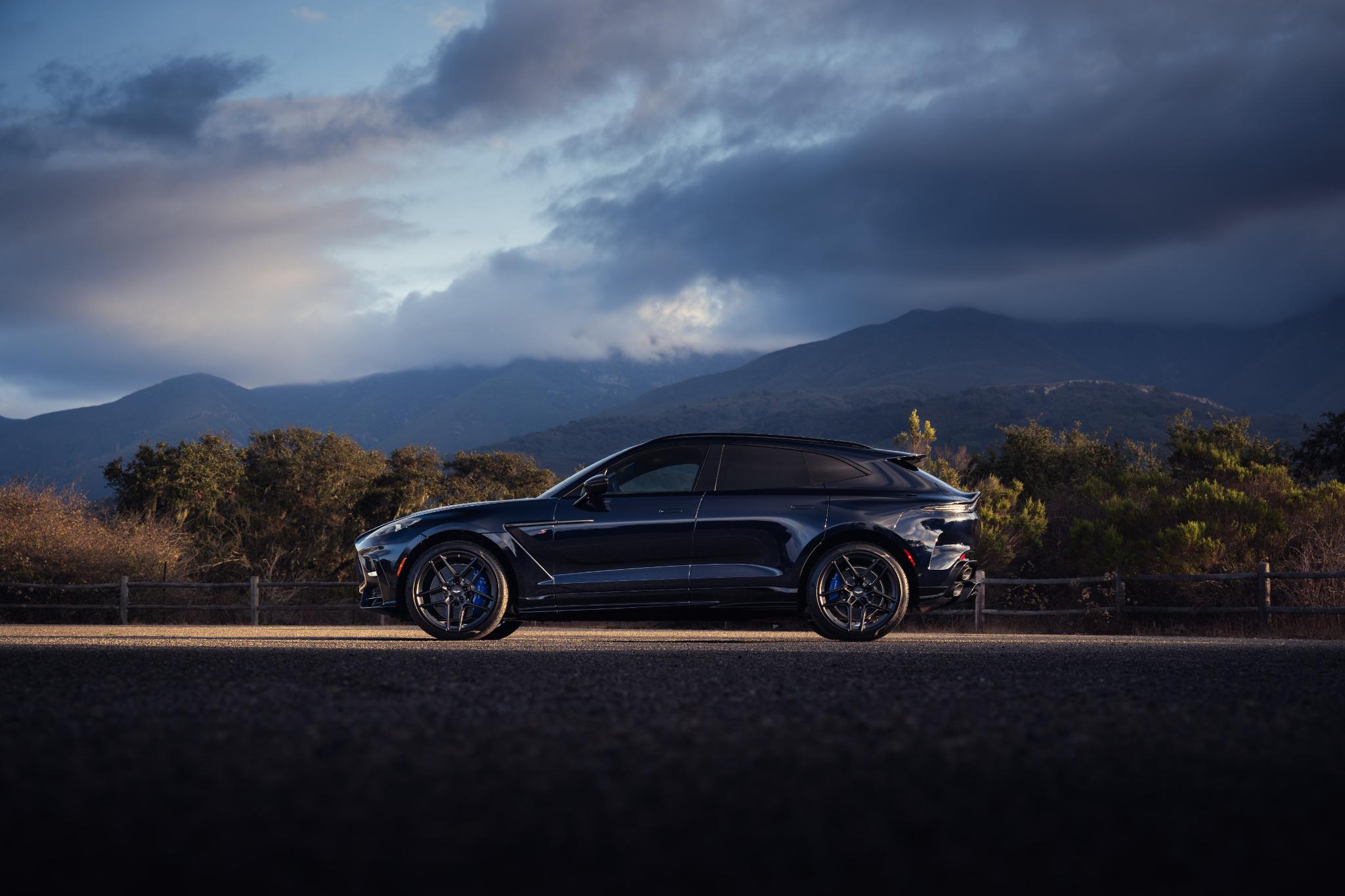 Rear three-quarter view of the Aston Martin DBX S showing the quad exhaust system.
