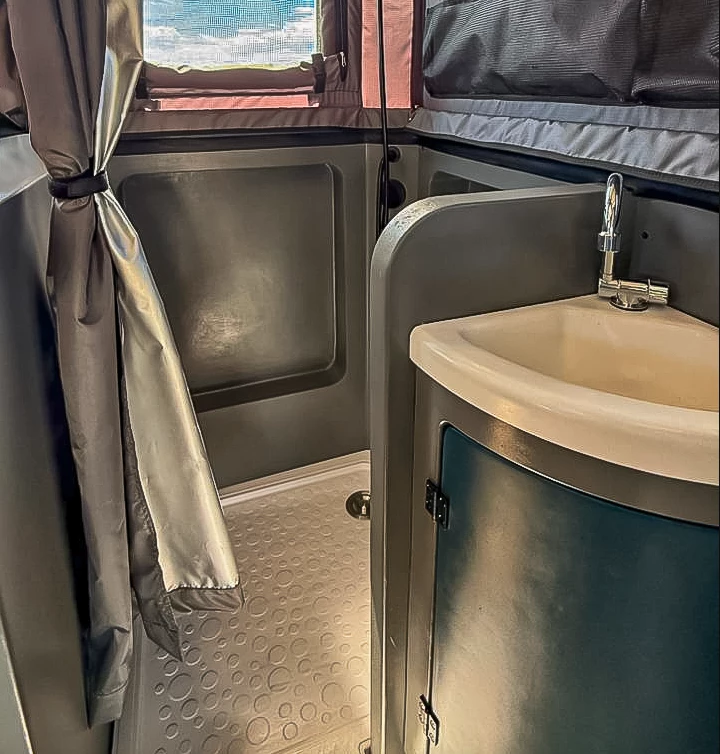 Interior view of the hybrid wet and dry bathroom inside the Invader Viator.