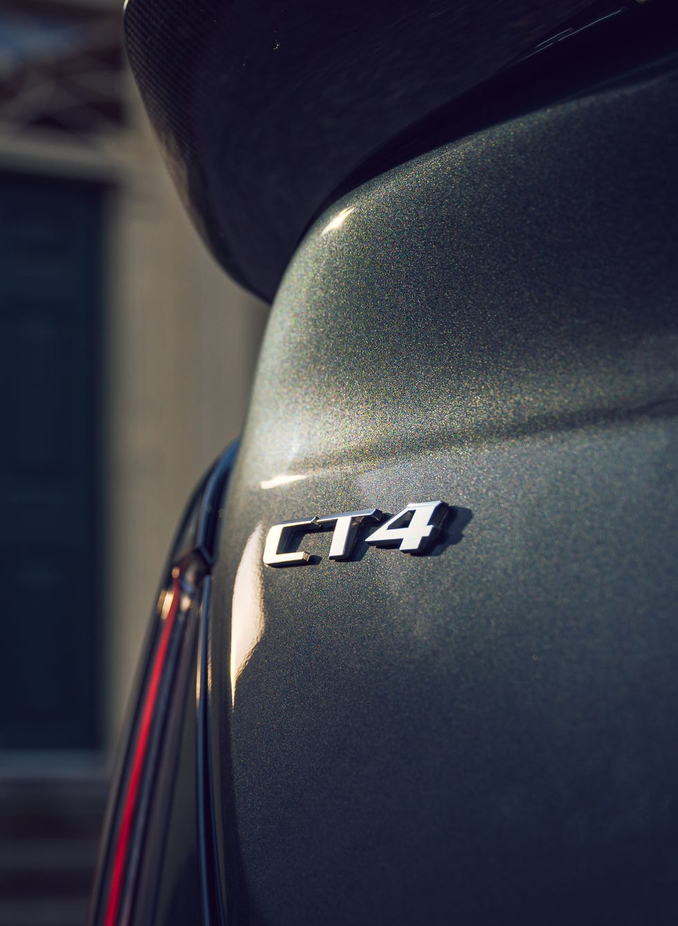 A front three-quarter view of a dark-colored Cadillac CT4-V Blackwing.