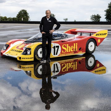 Close-up portrait of legendary racing driver Hans Joachim Stuck in his racing gear.