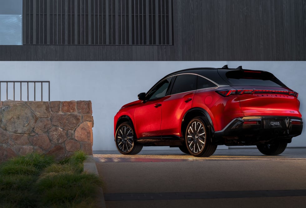 Side profile of a 2027 Infiniti QX65 Autograph AWD in a natural setting.