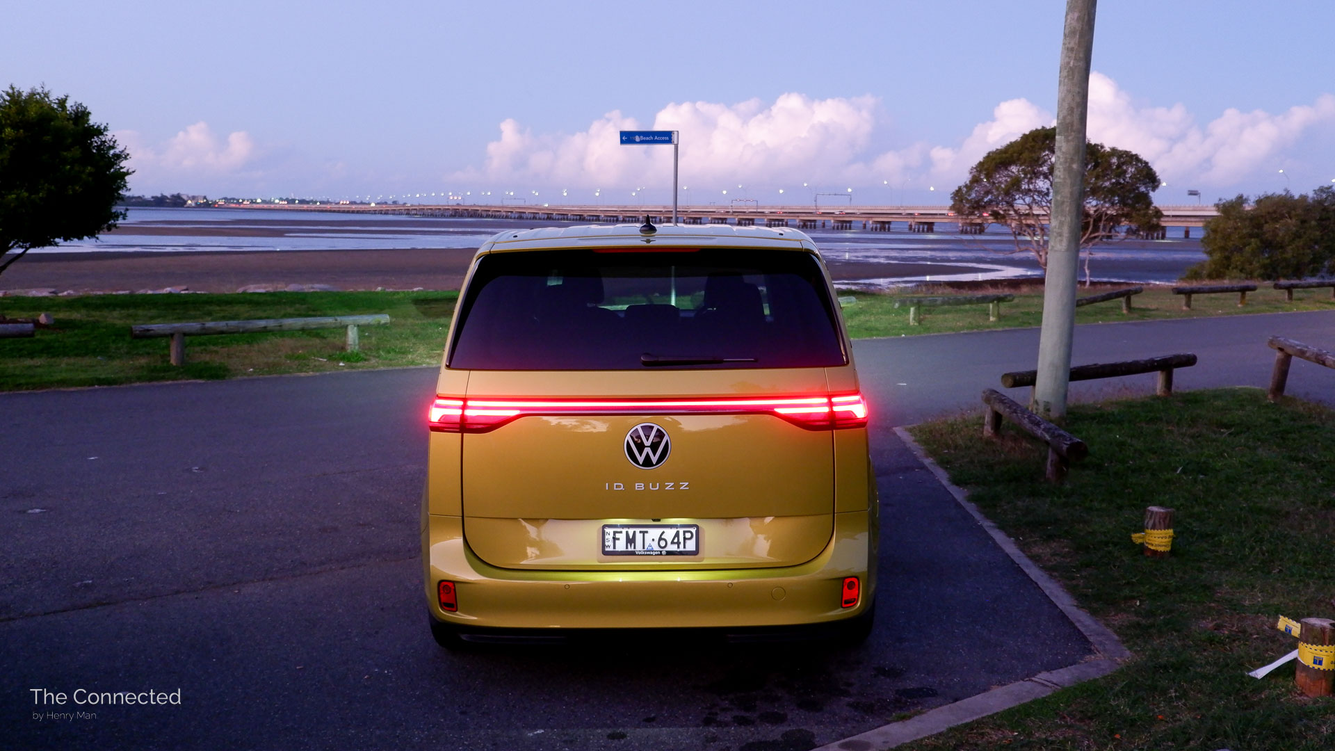 Rear view of the ID.Buzz at the coast during sunset.