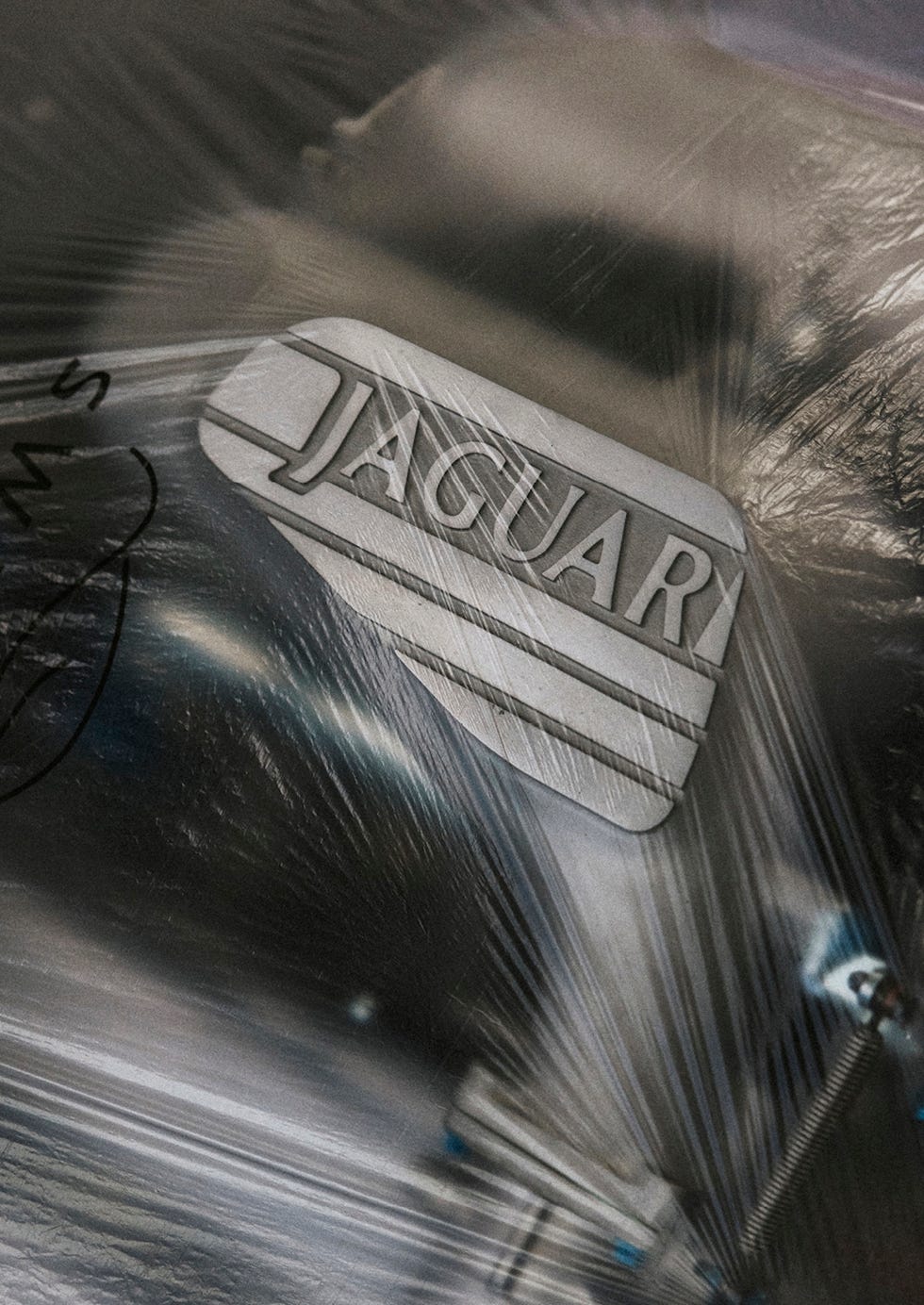 A close-up view of the Jaguar XJ220 twin-turbo V6 engine engine bay.