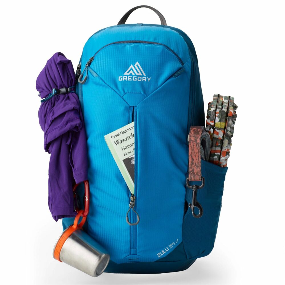 A blue Gregory Zulu 24 daypack in a studio setting.