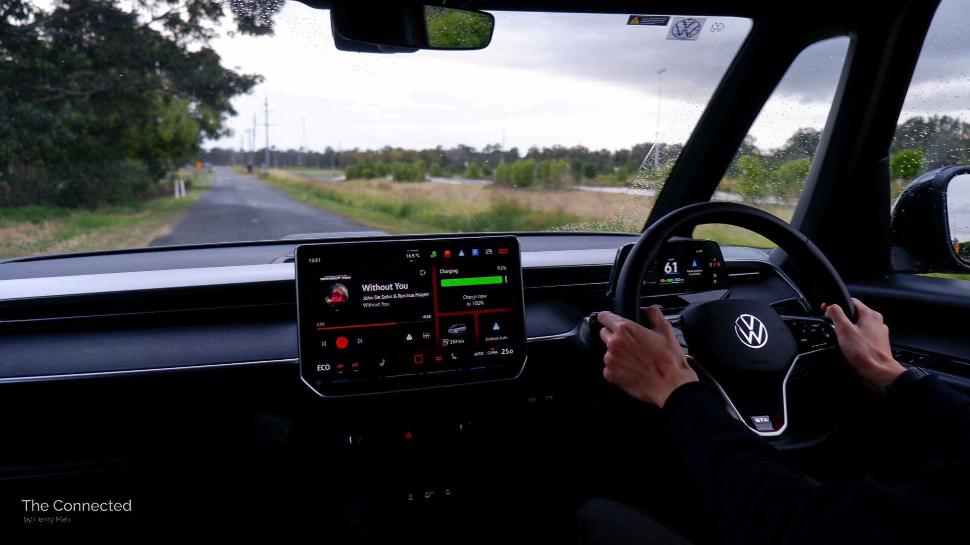 Volkswagen ID.Buzz being driven on a winding rural road.