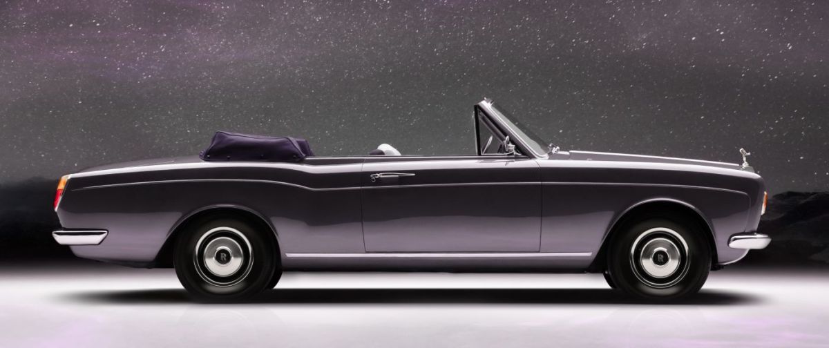 Side profile of a silver Halcyon Rolls-Royce Corniche electric conversion.