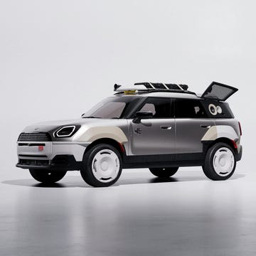 An off-road capable compact SUV equipped with a roof rack and adventure gear.