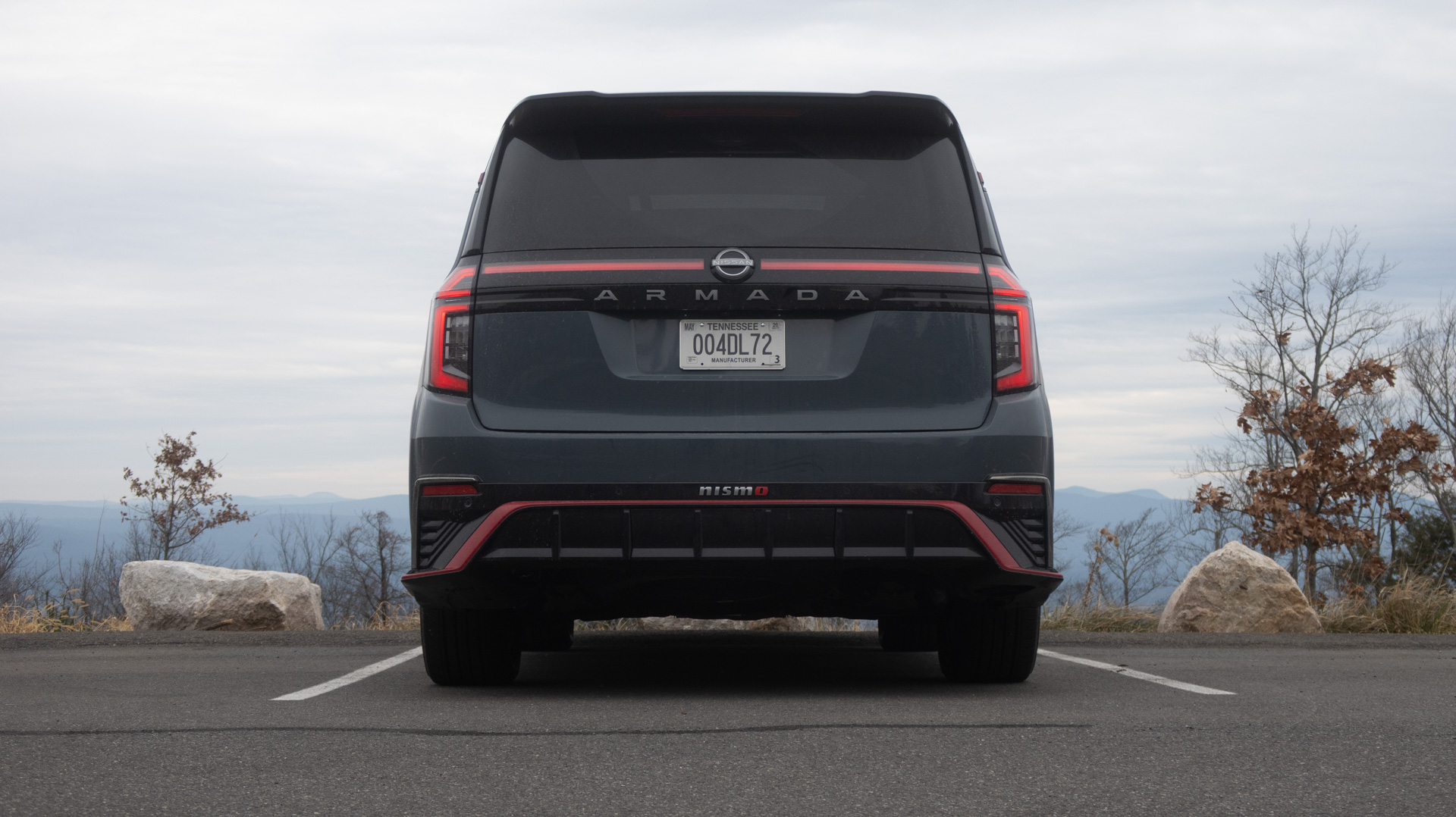 Rear view of the 2026 Nissan Armada NISMO showing the integrated rear diffuser and exhaust layout.