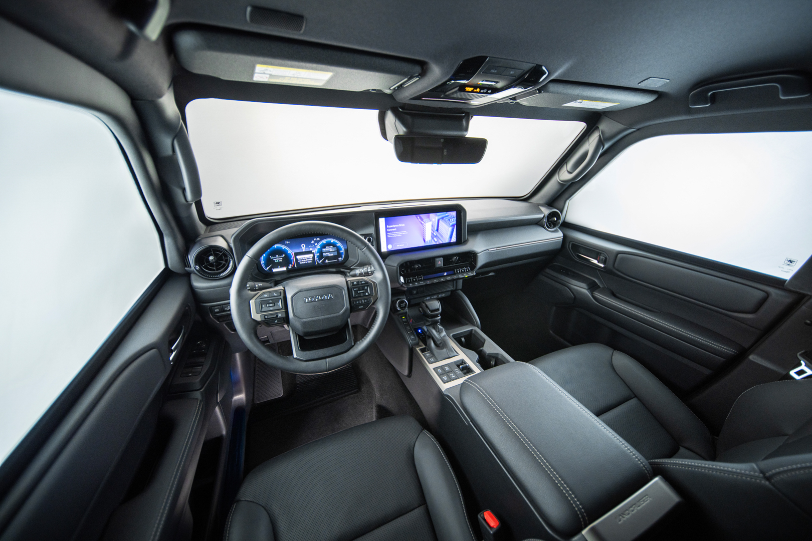 Close-up of the thick multi-layered ballistic glass window of an armored SUV.