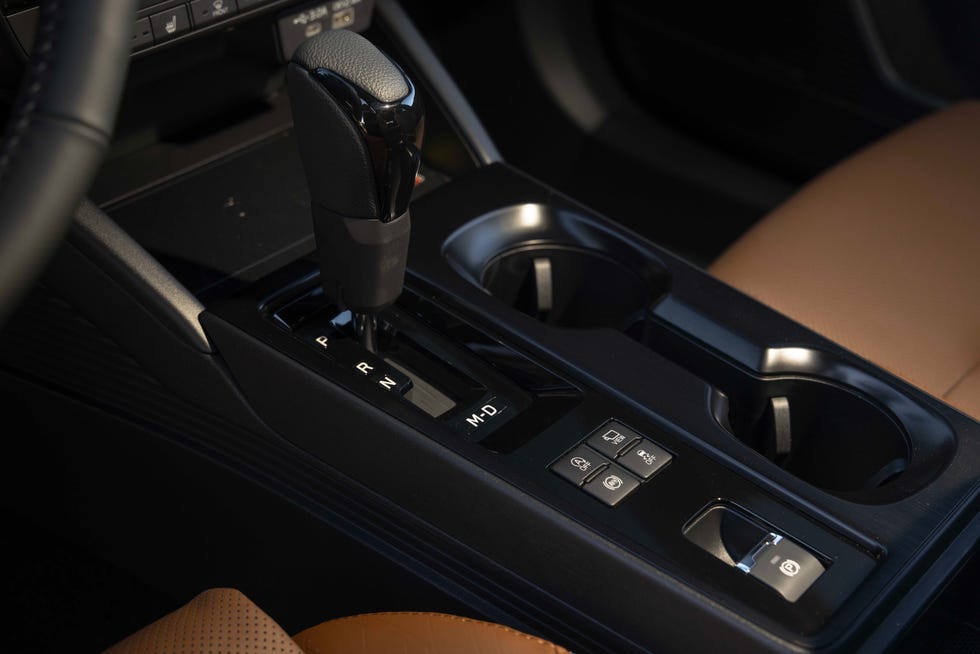 A 2026 Subaru Outback parked in a forest, emphasizing its appeal to outdoor enthusiasts