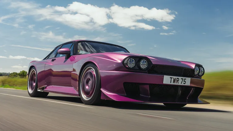 Side profile of the TWR Supercat highlighting its widebody stance and carbon fiber lines.