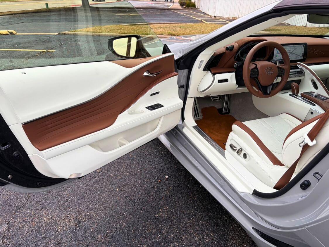 Driver-side view of the Lexus LC 500 steering wheel and dash.