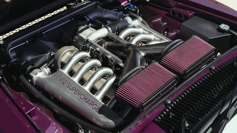 Close-up of the 5.6-liter V12 engine with the Rotrex supercharger visible.