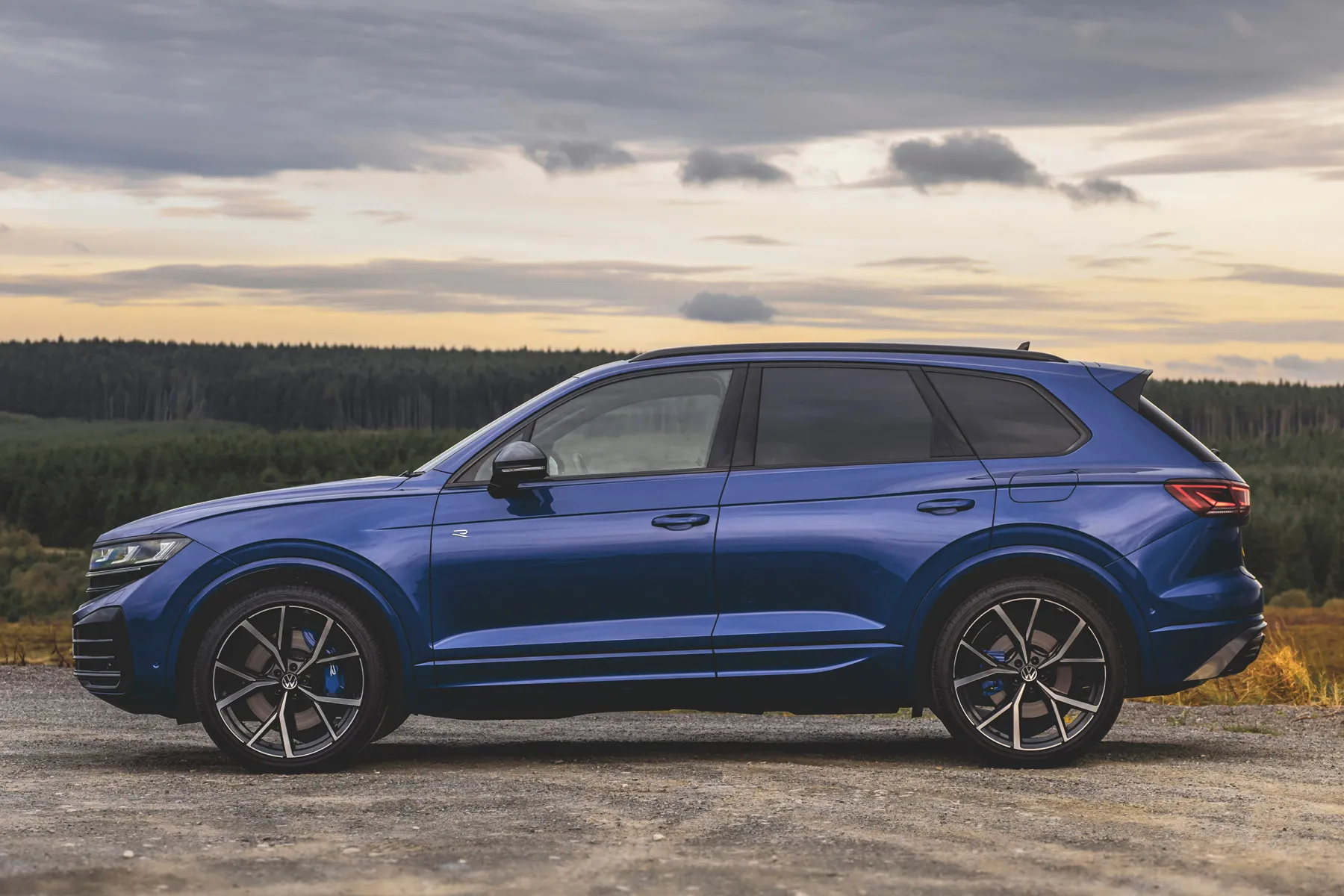 Side profile view of a silver Volkswagen Touareg highlighting its large luxury proportions.
