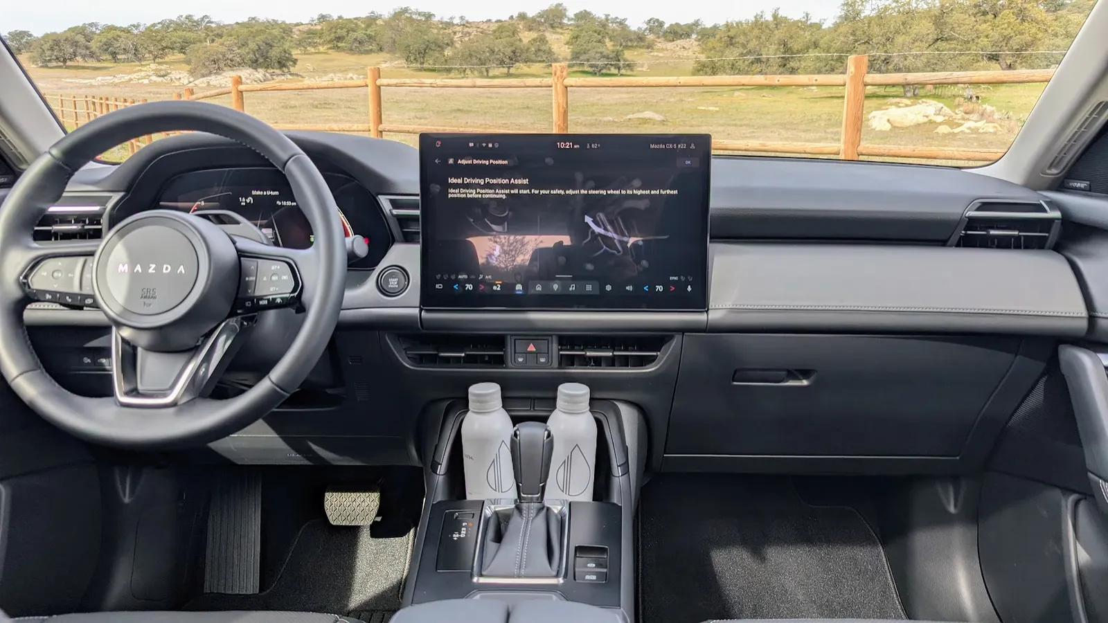 Interior dashboard view of the 2026 Mazda CX-5 highlighting the infotainment screen and premium cabin materials.