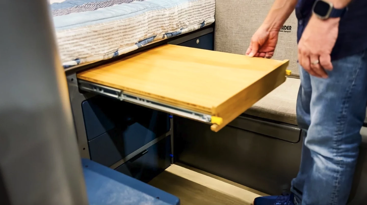 Interior of the Invader Viator showing the modern slide-out center dinette table.