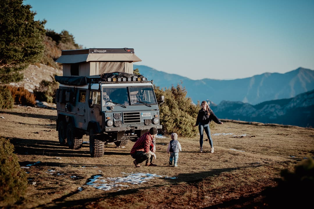 Front three-quarter view of the Volvo C304 6x6 off-roading in a coastal landscape.