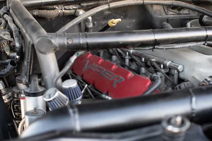 Close-up of an 8.3-liter V10 engine installed in the engine bay of a Jeep J10.