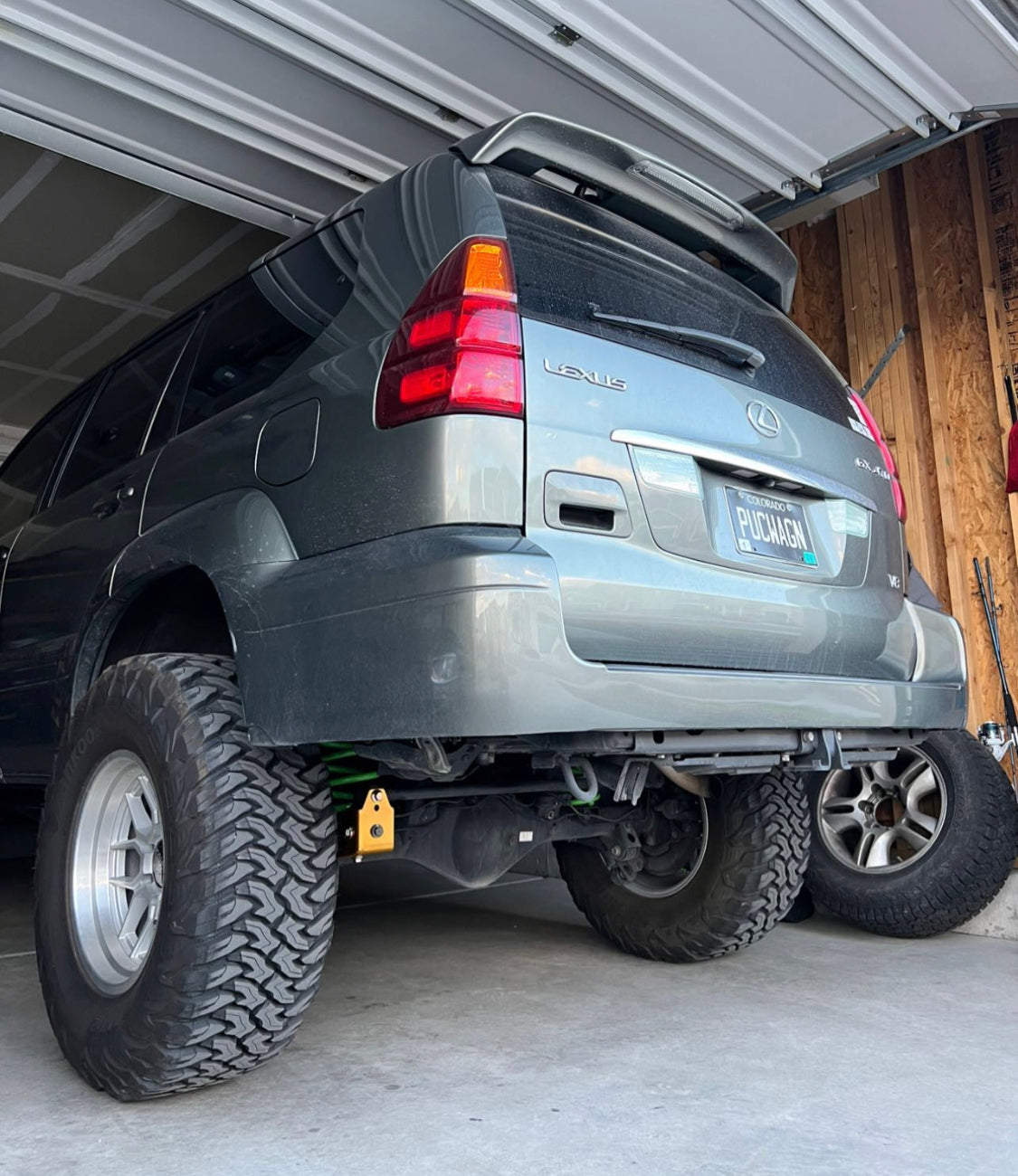 Underbody view of a Lexus GX460 with a DrKDSS track bar correction kit installed for improved rear axle geometry.