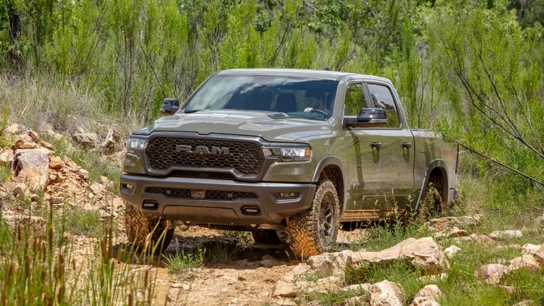 Interior shot of the Ram Rebel X cabin showing the 14.4-inch touchscreen and red leather accents.