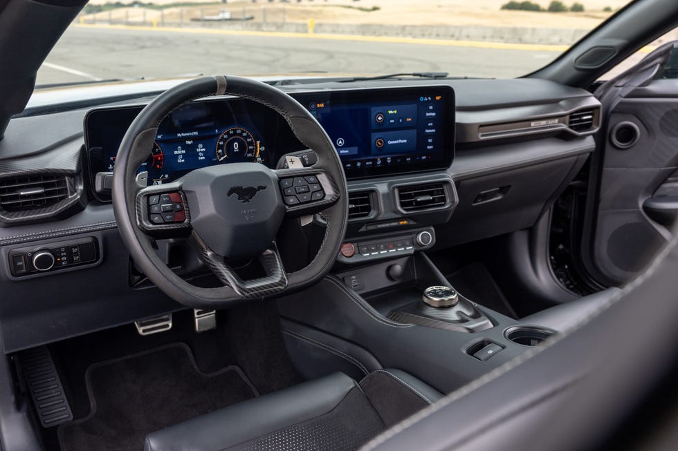 Interior view of the 2025 Ford Mustang GTD dashboard and steering wheel.