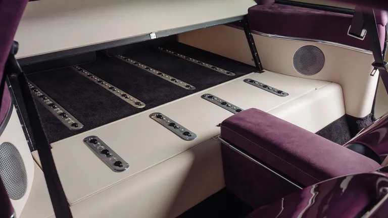 Action shot focusing on the gear shifter inside the Supercat cabin.