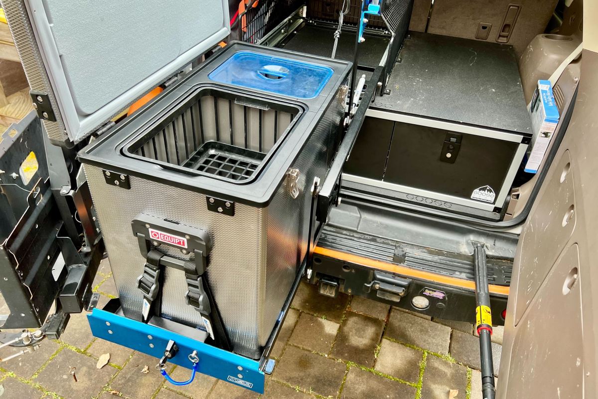 Interior view of a National Luna dual-zone fridge showing separate fridge and freezer compartments.