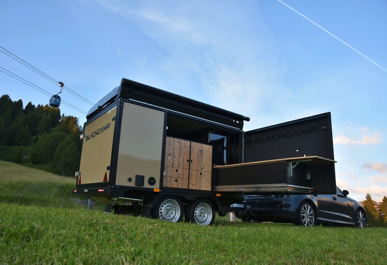 Blackcamp Freeda trailer parked in a rugged alpine mountain setting