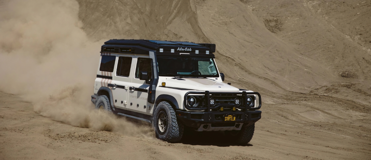 The Grand Bohemian camper parked in a wilderness area, showcasing its off-grid readiness.