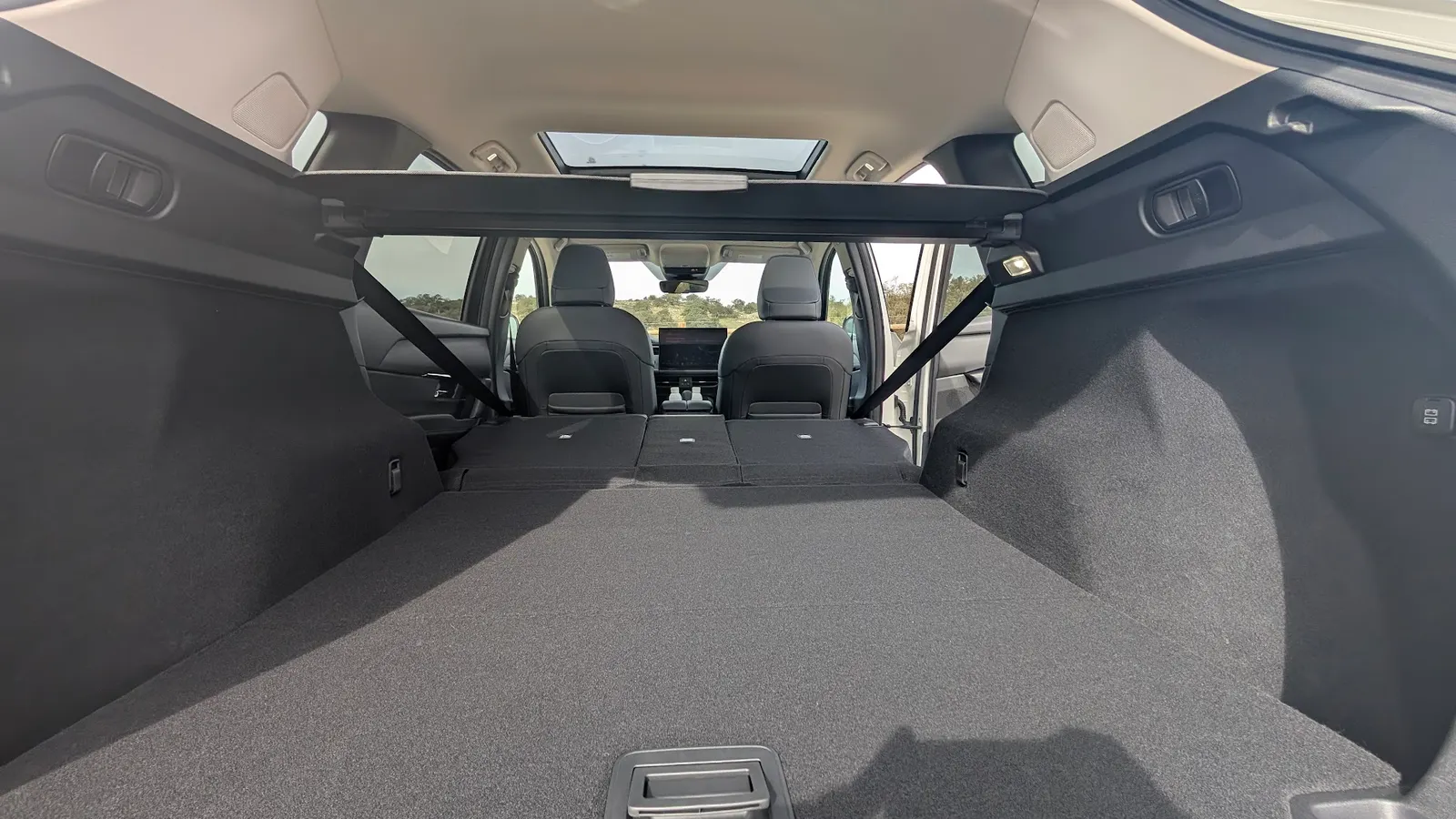 View of the expanded cargo area in the 2026 Mazda CX-5 with rear seats folded down.