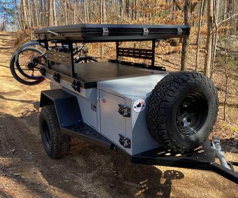 Front view of the Rustic Mountain Overland Patrol XCT showing its storage box and rugged construction.