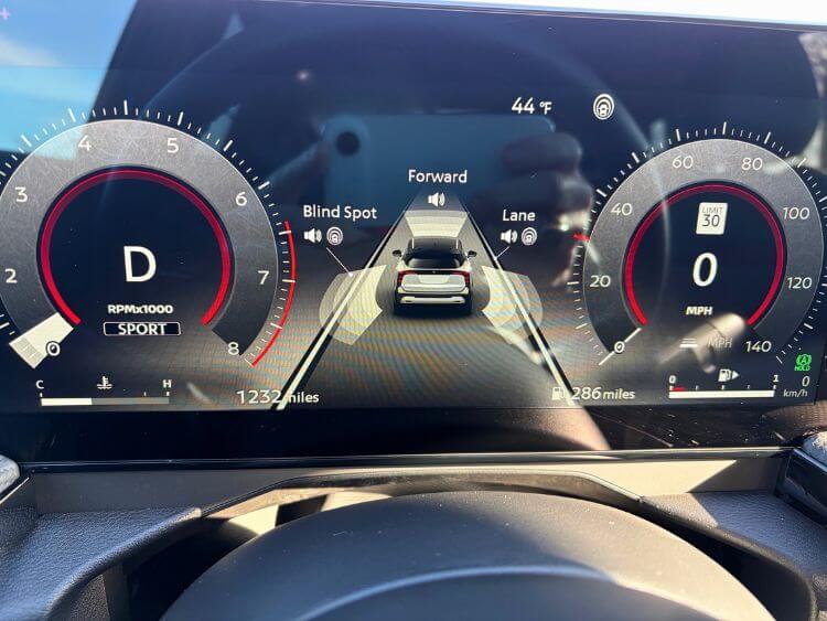 Digital gauge cluster and steering wheel controls in the 2026 Nissan Kicks SR.