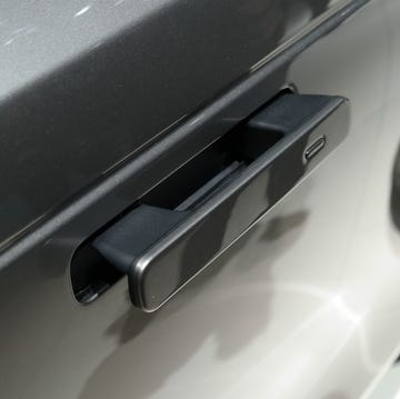 Close-up of a Range Rover Velar door handle representing high-end automotive design.