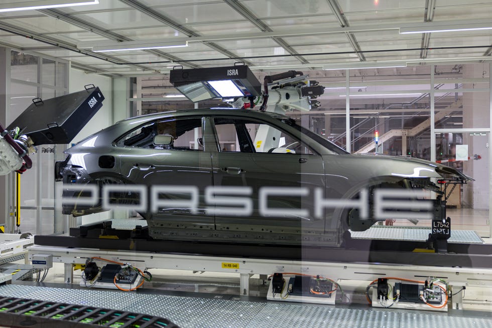 A new all-electric Porsche Macan SUV being produced in a factory