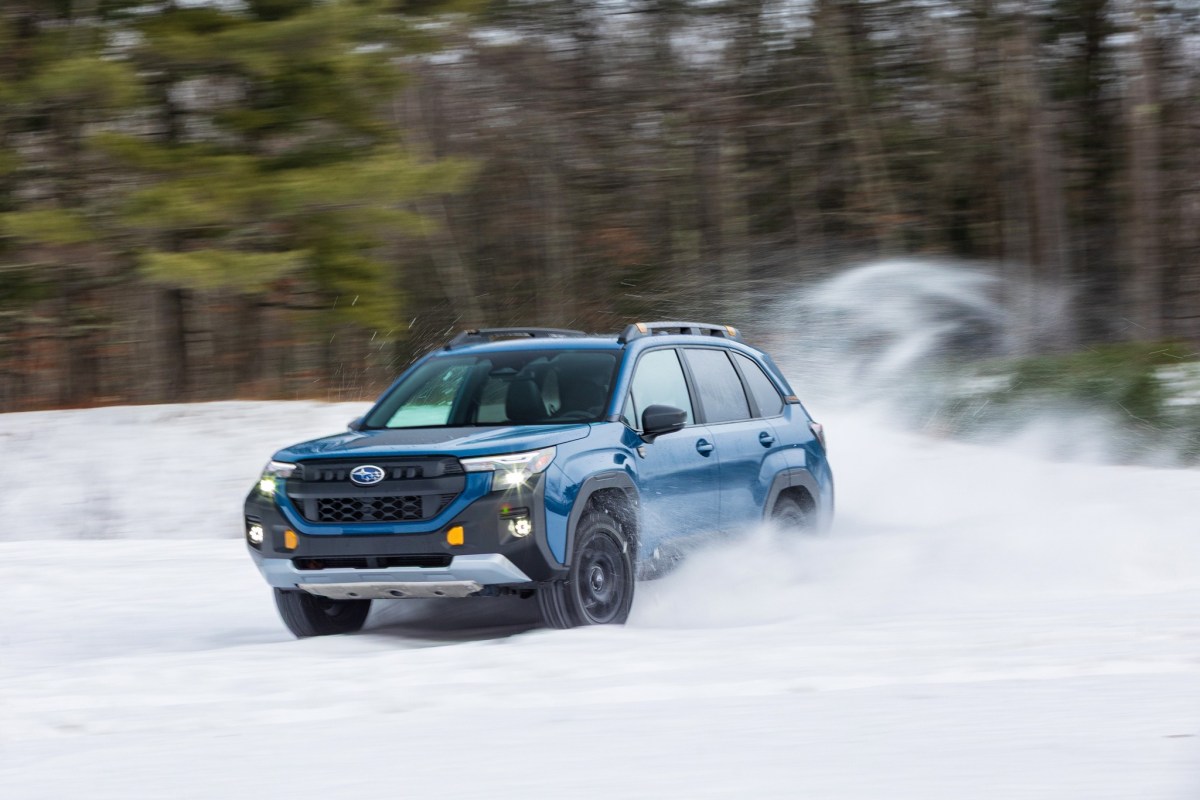 Side profile of the 2026 Subaru Forester Wilderness showing the increased 9.3-inch ground clearance and all-terrain tires.