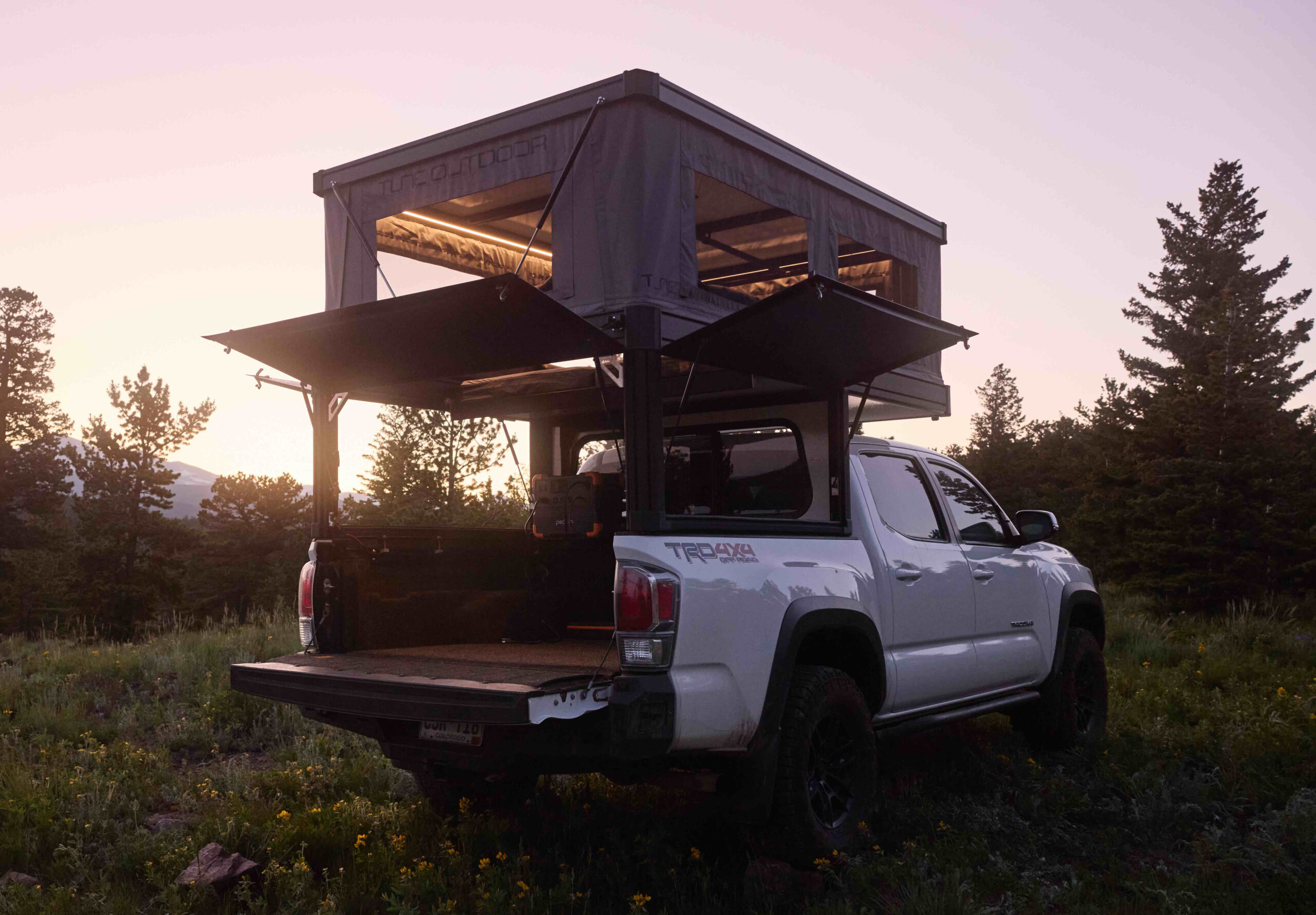 Side profile of a slim Tune M1Lite camper showing its compact aerodynamic shape.