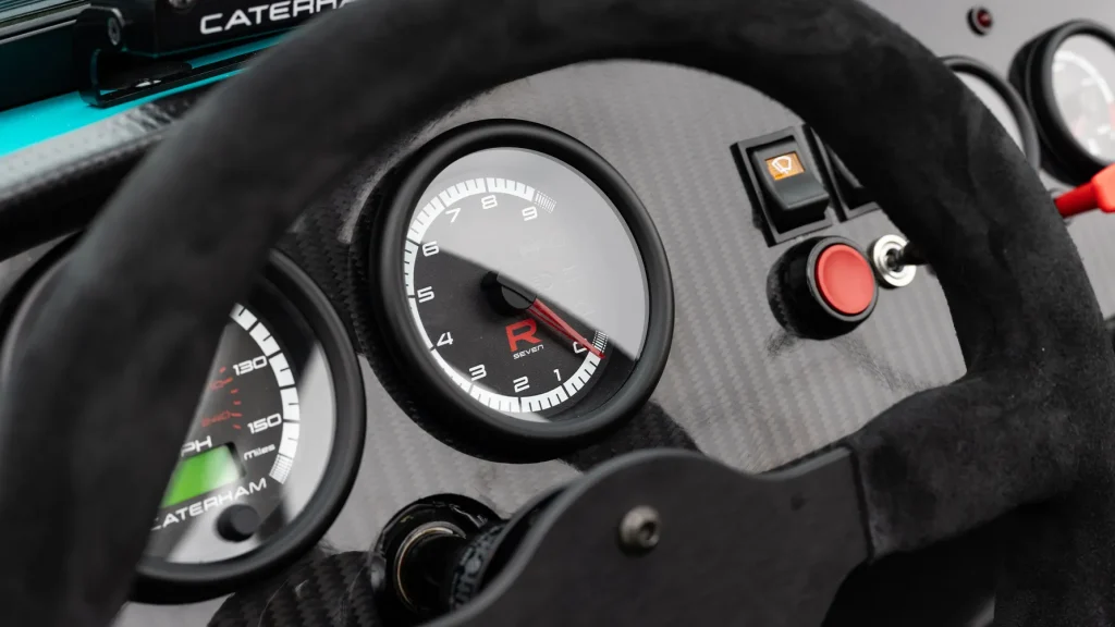 Minimalist dashboard of the Caterham Seven R Miami edition showing analog gauges.