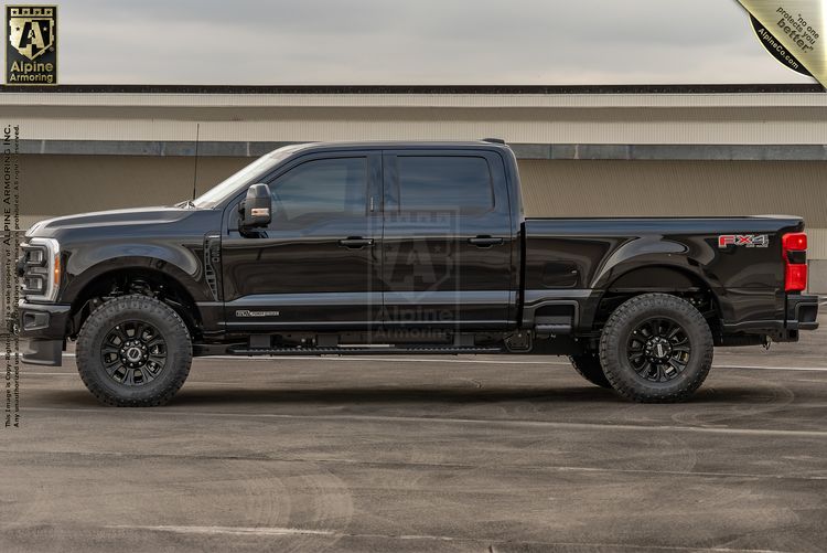A heavily modified and lifted Ford F-350 Super Duty with full ballistic armoring.