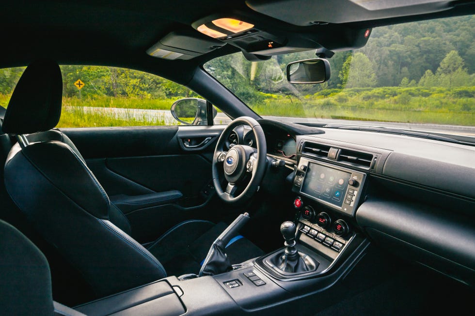 Interior view of the 2026 Subaru BRZ tS showing the steering wheel, digital instrument cluster, and dashboard.
