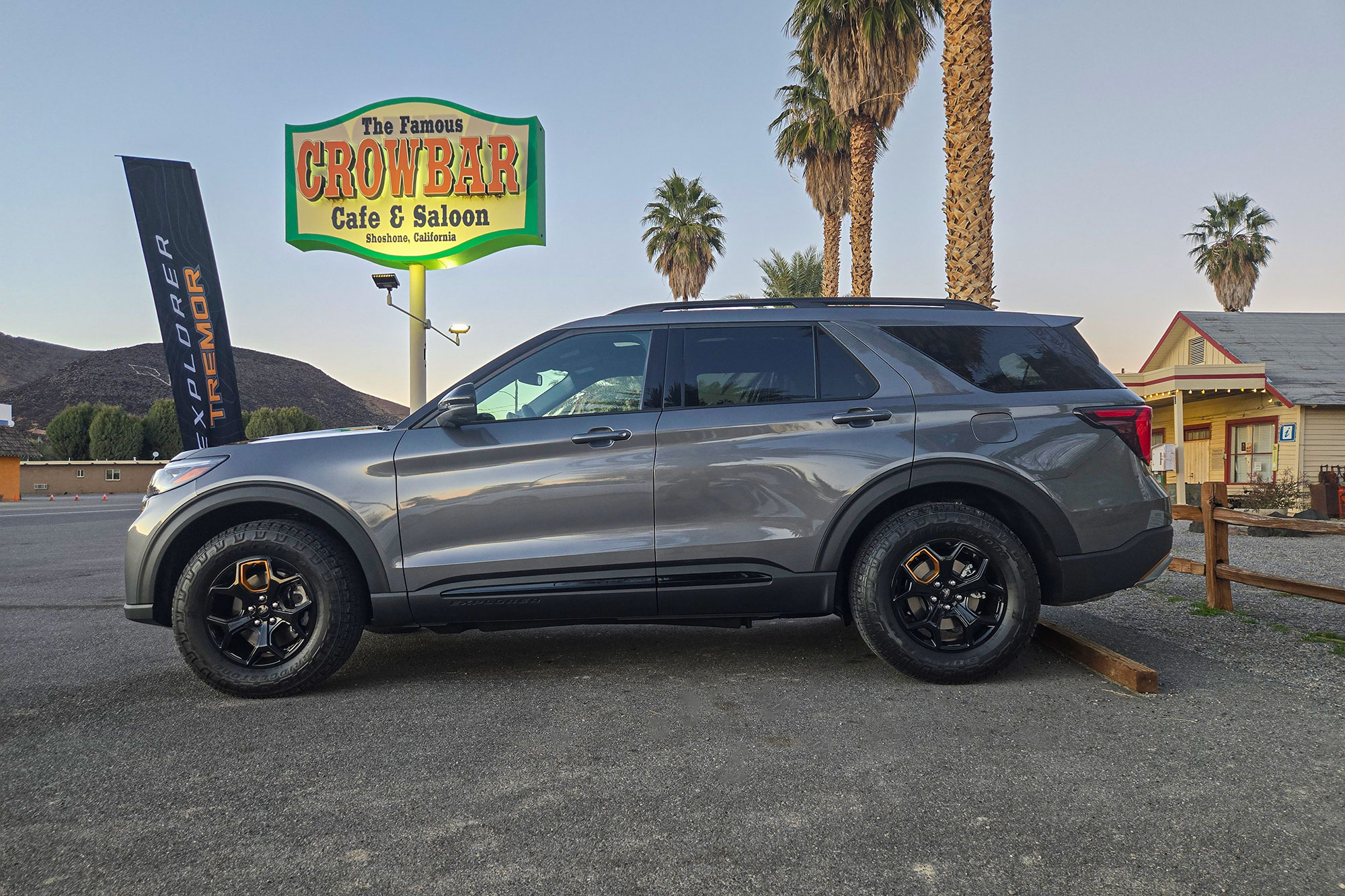Side view of the 2026 Ford Explorer Tremor driving on a paved highway.