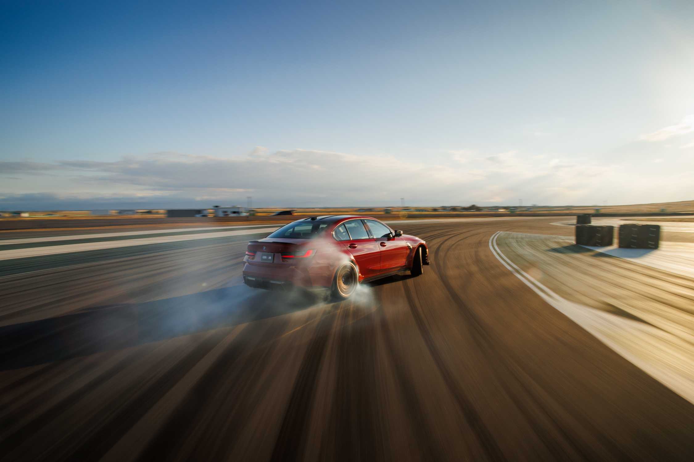 Dynamic side view of the BMW M3 CS showcasing its aerodynamic silhouette.