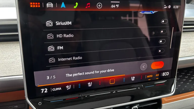 The ID Buzz infotainment interface showing audio source and volume customization menu.