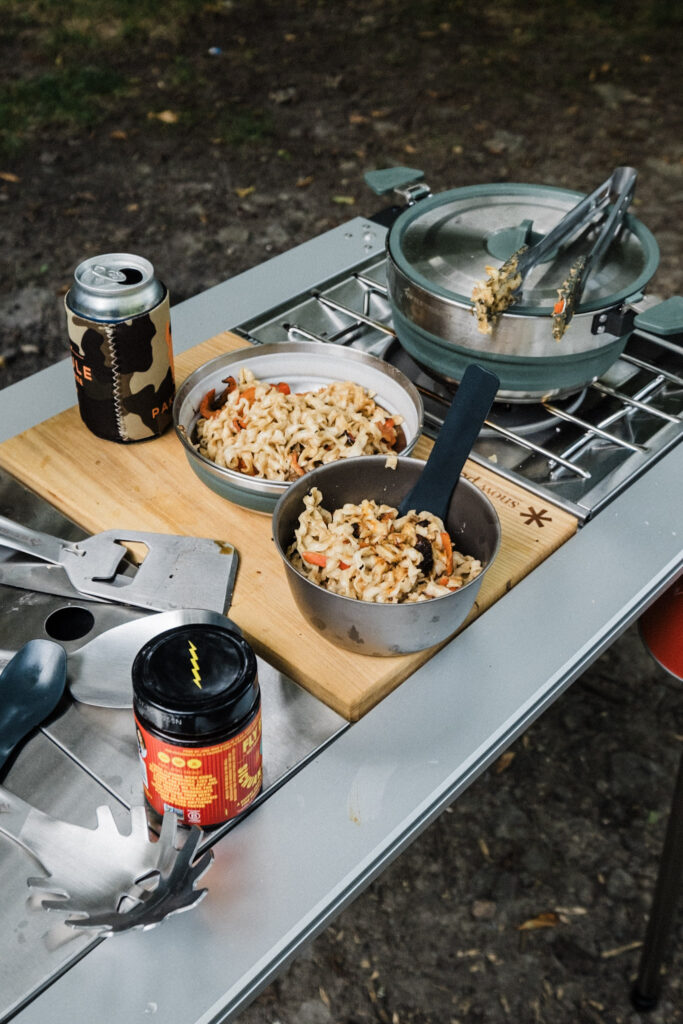 Sea to Summit Detour stainless steel utensils nested together inside a black silicone sleeve.