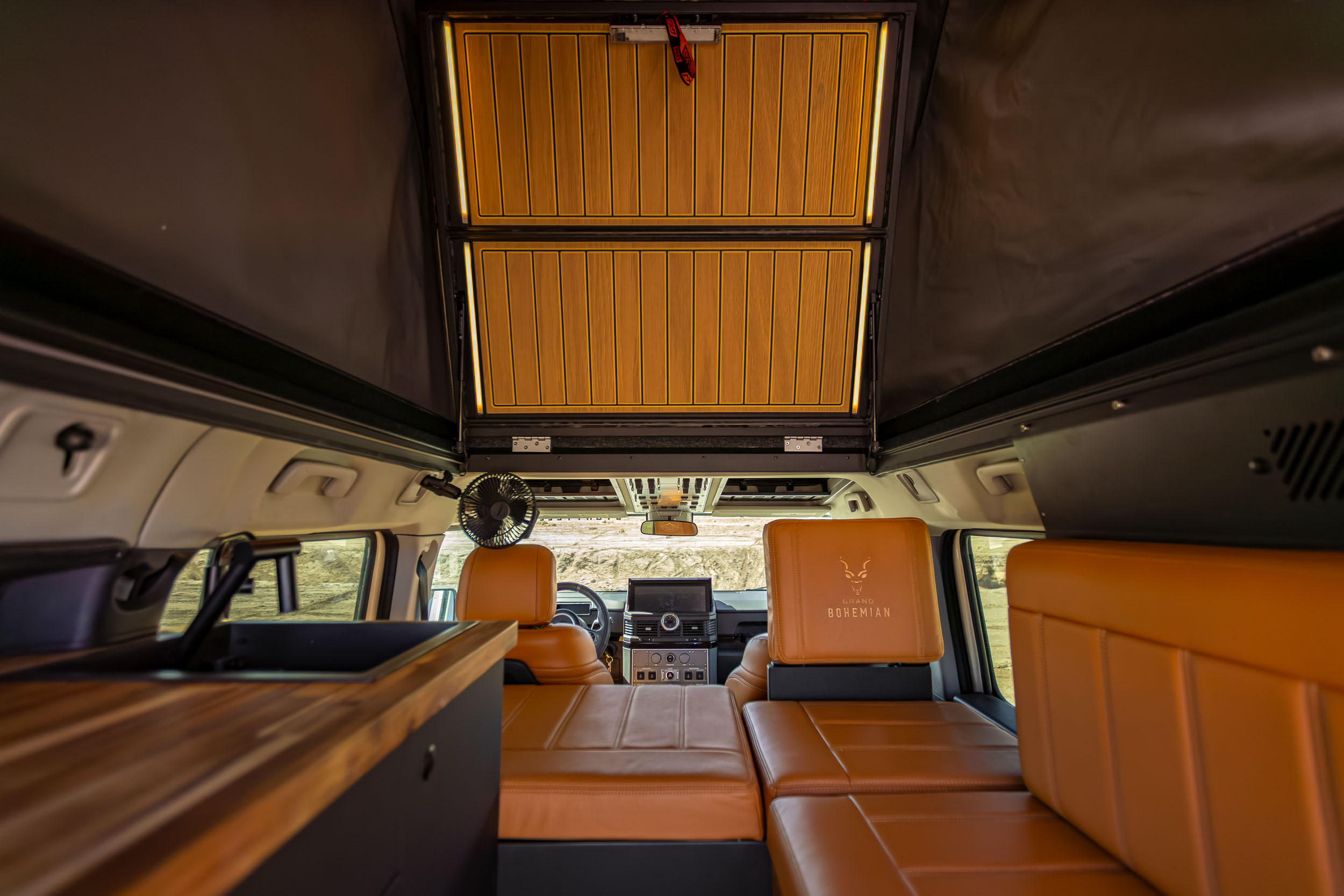 The Alu-Cab Silenus roof conversion deployed on top of the Grand Bohemian camper.