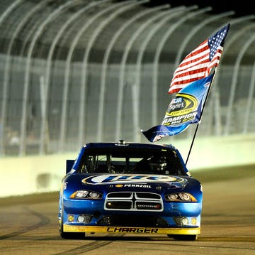 A Ford vehicle prominently displayed at a professional racing event.
