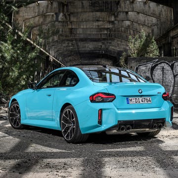A modern BMW sports car representing the high-performance sedan competition.