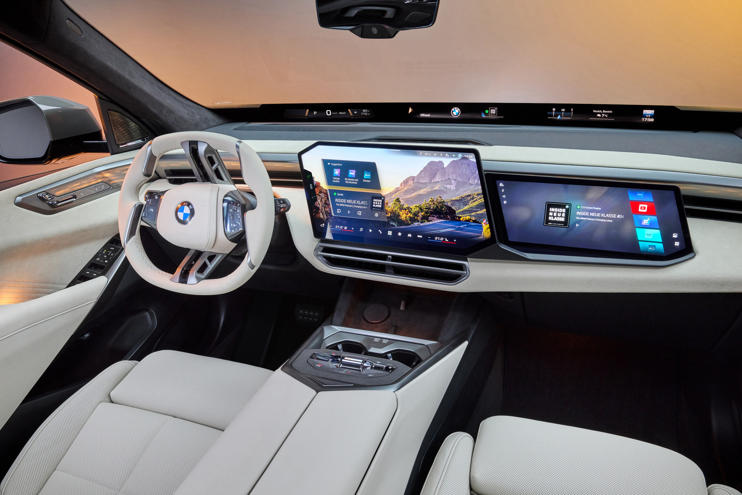 Close-up of the BMW X5 dashboard featuring the Panoramic iDrive twin screens.