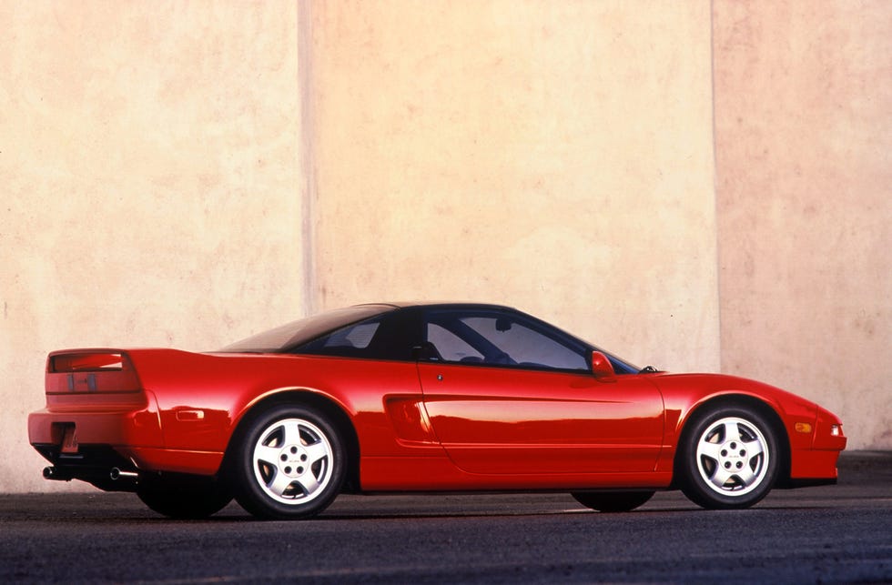 A pristine silver 1993 Acura NSX in a neutral setting.