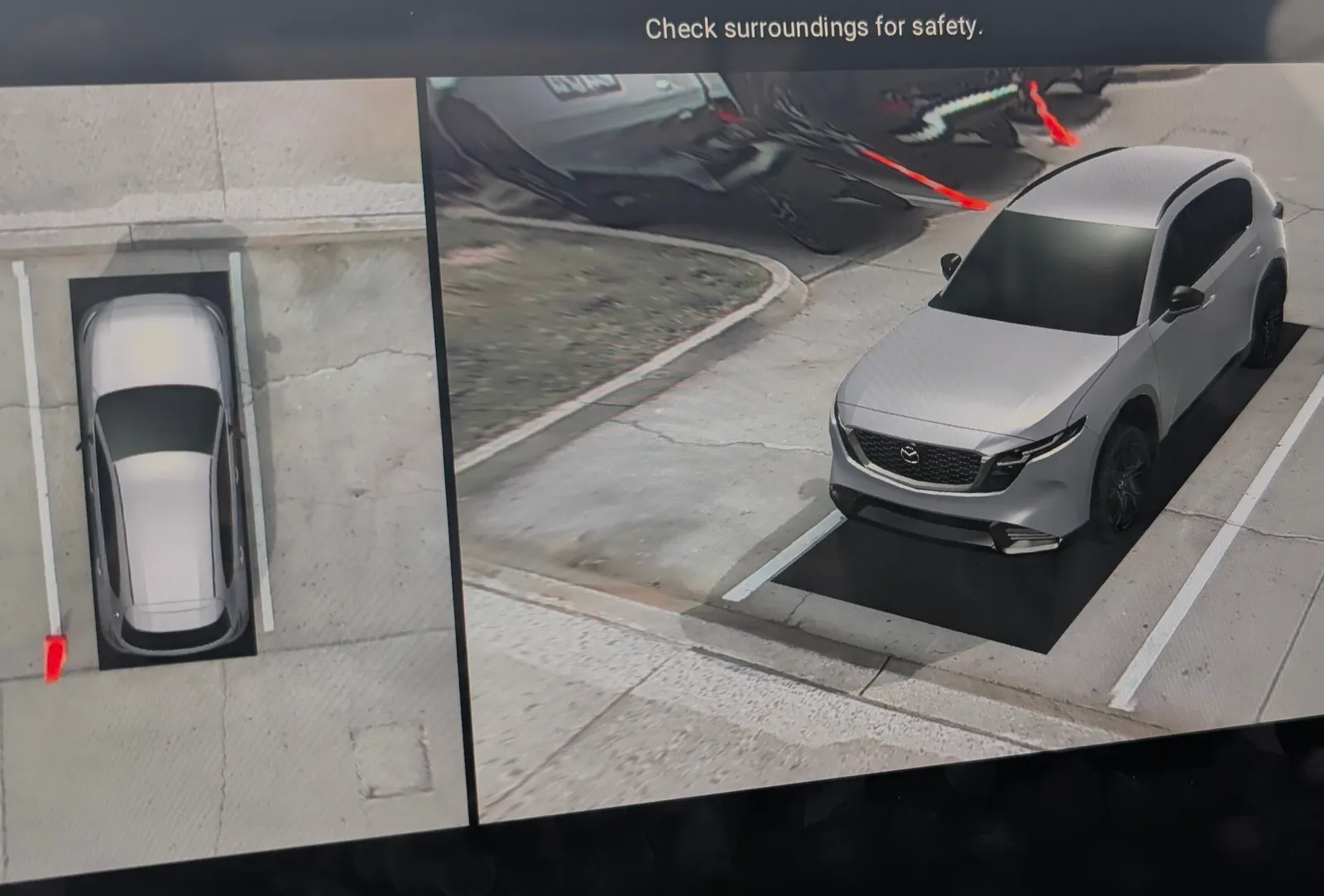 Close-up of the 2026 Mazda CX-5 central screen showing the parking assistance and camera system.